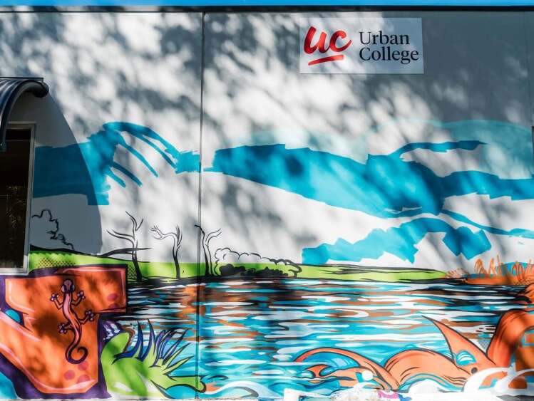 mural on campus wall with Urban College logo
