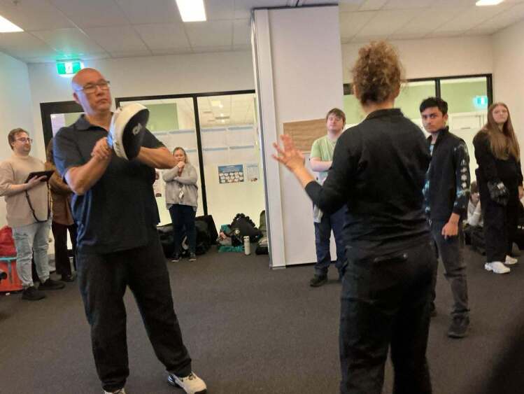 Presenters demonstrating to students