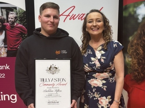 Lachlan with his Tilly Aston Community Award standing with Mary Doyle MP