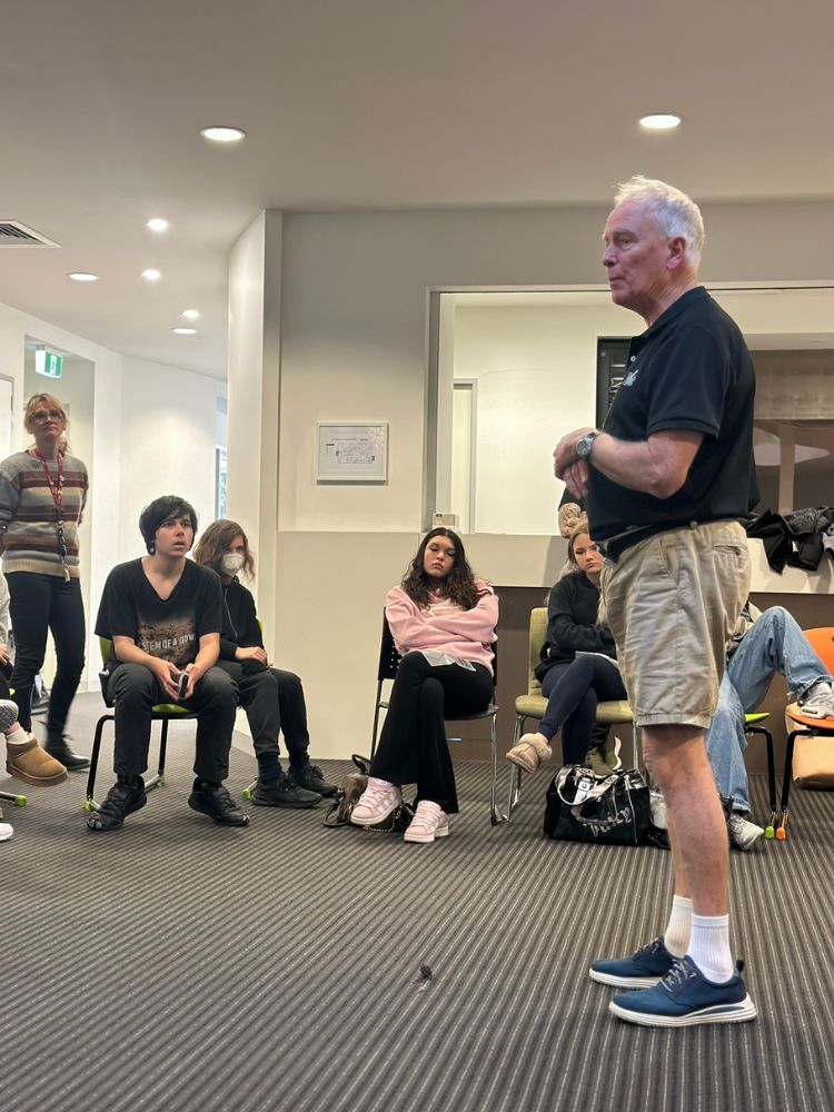 instructor introducing first aid class to group of students