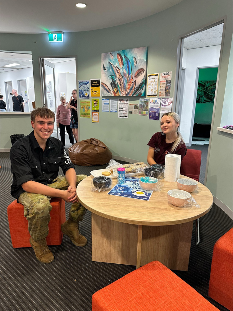 Students enjoying a break and eating the home made cakes