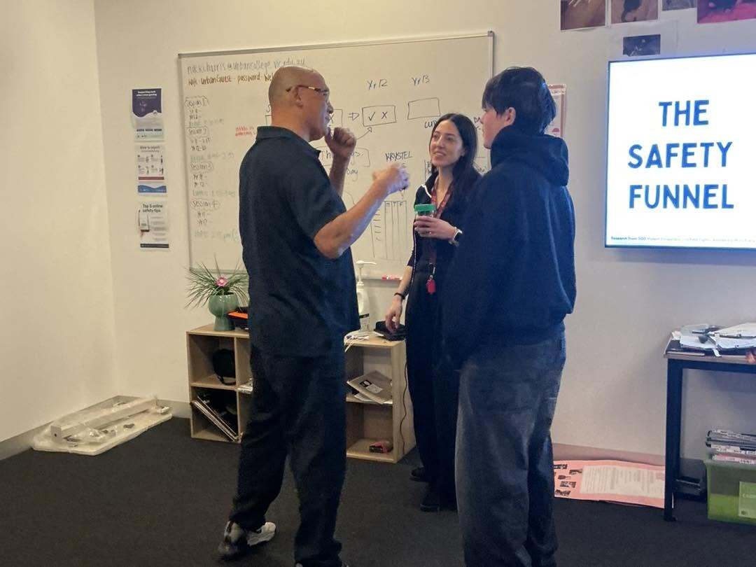 Presenter and teacher discuss safety with student