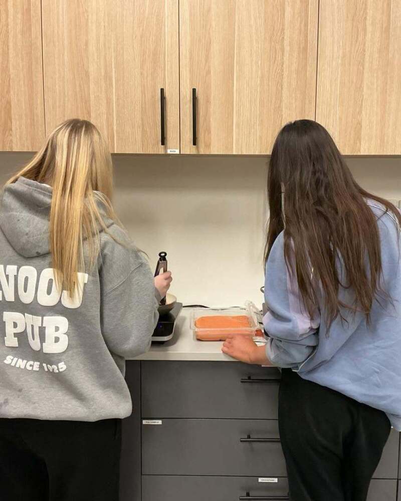 Year 10 students preparing food together during Wellbeing Day at Urban College