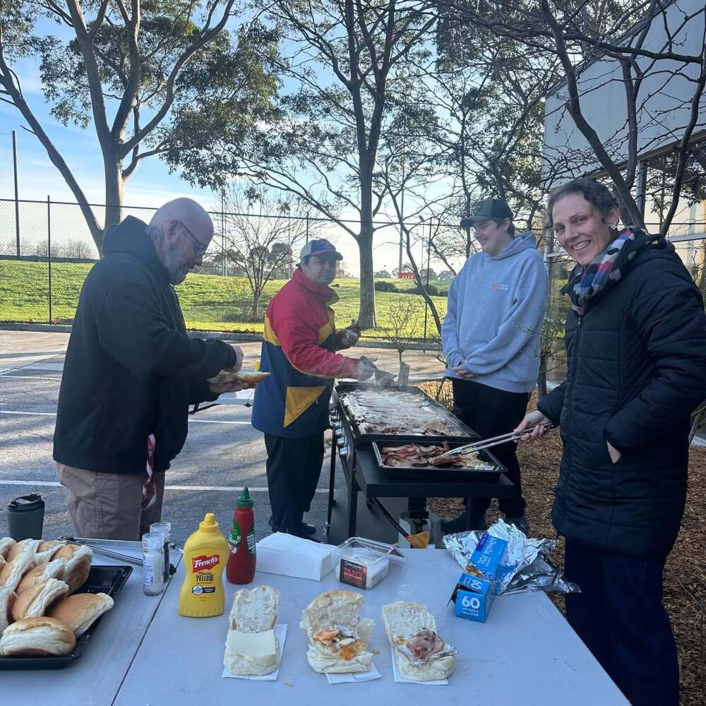 cooking up a storm at the breakfast BBQ with bacon and egg rolls