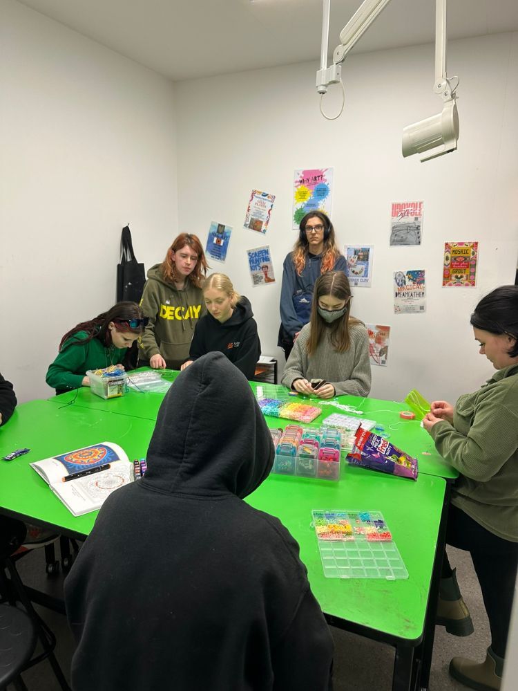 Art room beads activity with 6 students 1 teacher