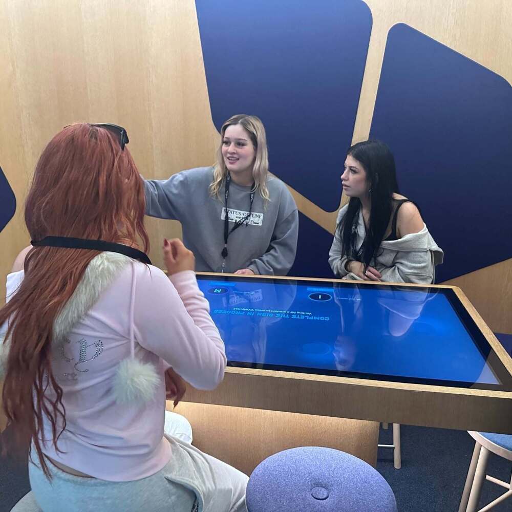 Year 12 students completing an interactive road safety activity during their museum excursion