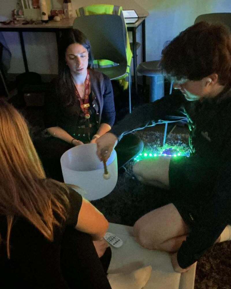 Students taking part in a relaxing sound bowl session during Urban College Wellbeing Day