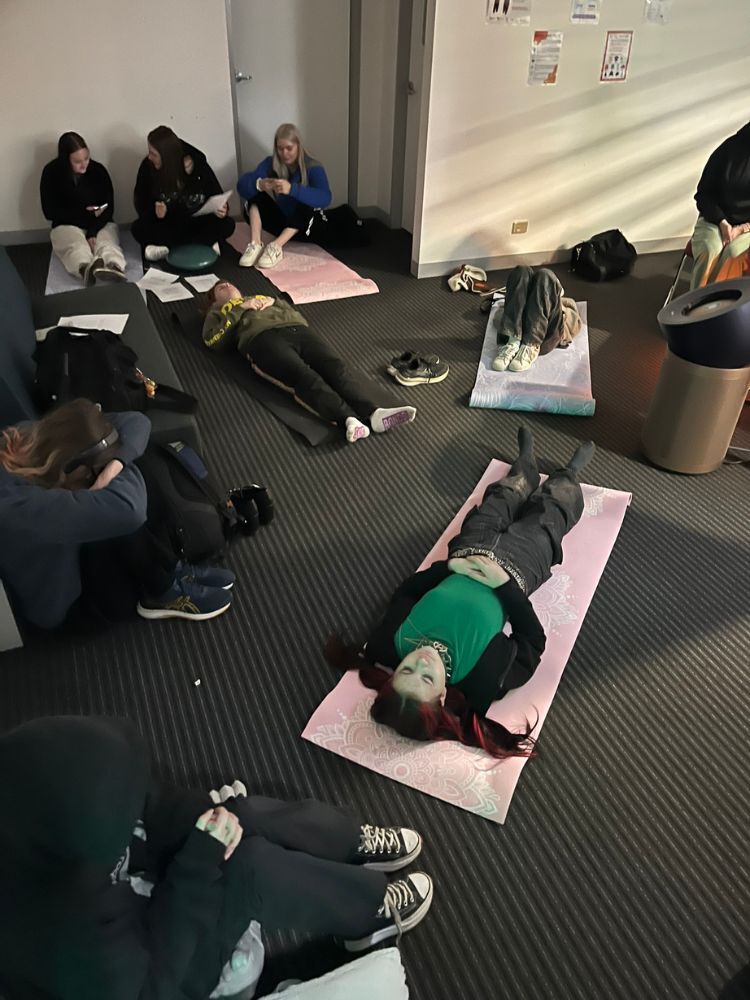 group of students meditating yoga mats