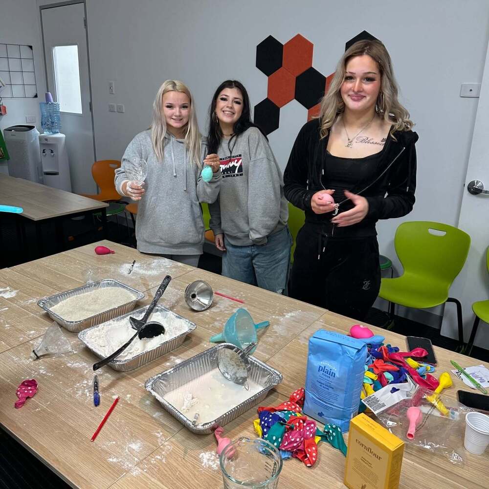 students supporting each other at the baking station