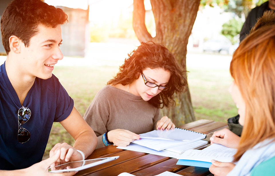 teenagers studying outside